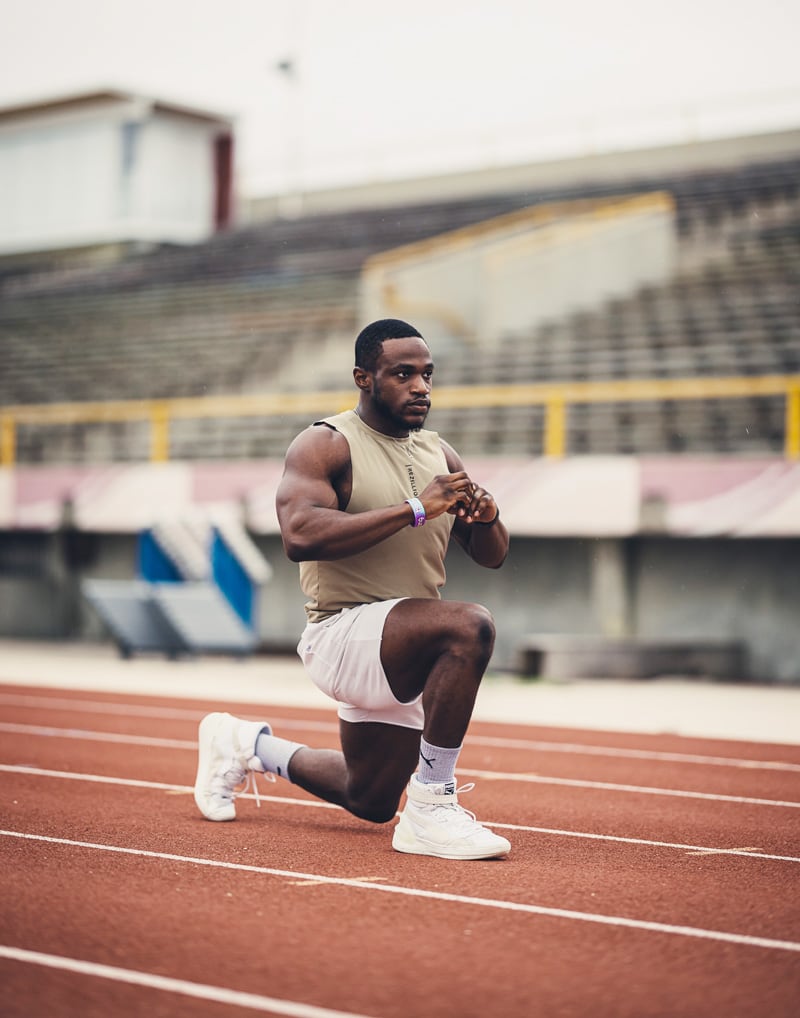 Coach is working out outdoors.